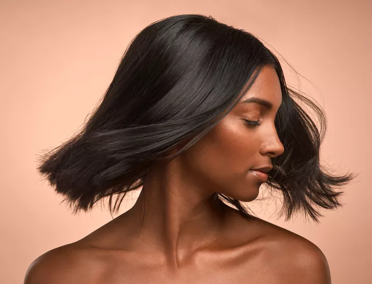 Transform Your Hair: The Best Daily Hair Care for Reducing Shedding Fast 1 a black woman with nice hair